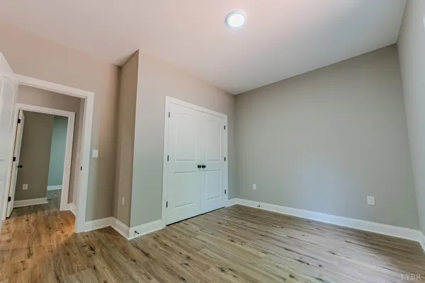 a view of a livingroom with furniture window and wooden floor