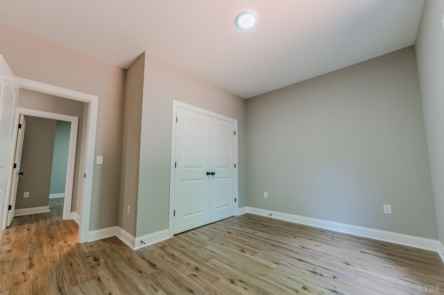 109 Tosh Lane Goodview, VA 24095 - Photo 23 of 32 a view of wooden floor and windows in a room