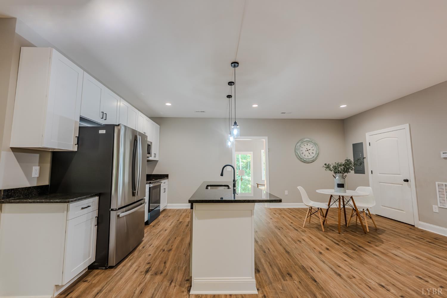109 Tosh Lane Goodview, VA 24095 - Photo 26 of 32 a living room with furniture a large window and stainless steel appliances