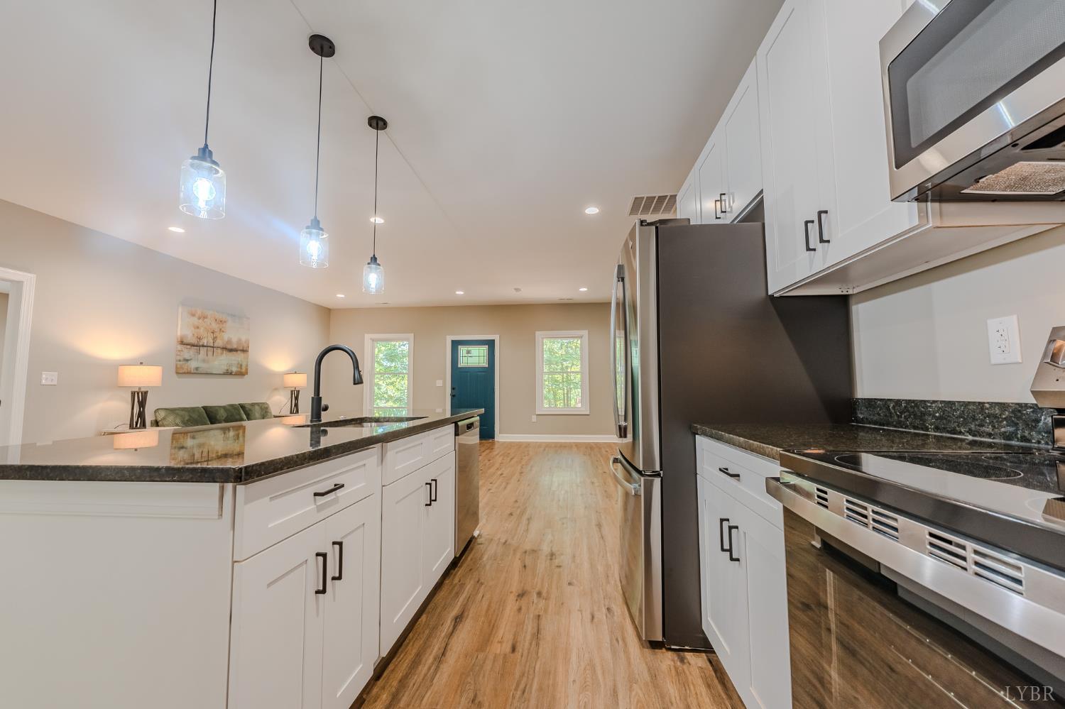 109 Tosh Lane Goodview, VA 24095 - Photo 29 of 32 a kitchen with granite countertop a sink stainless steel appliances and cabinets