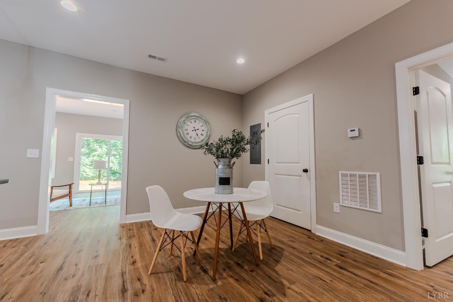 109 Tosh Lane Goodview, VA 24095 - Photo 31 of 32 a view of a dining room with furniture window and wooden floor
