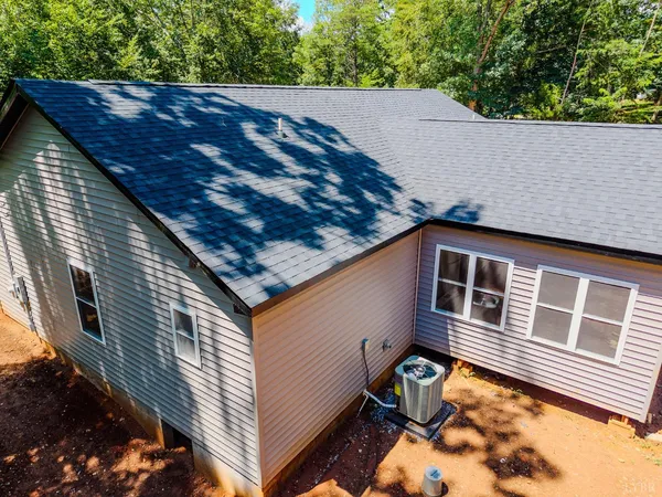 a view of a big yard with lots of green space