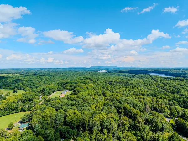 a large living room with stainless steel appliances furniture