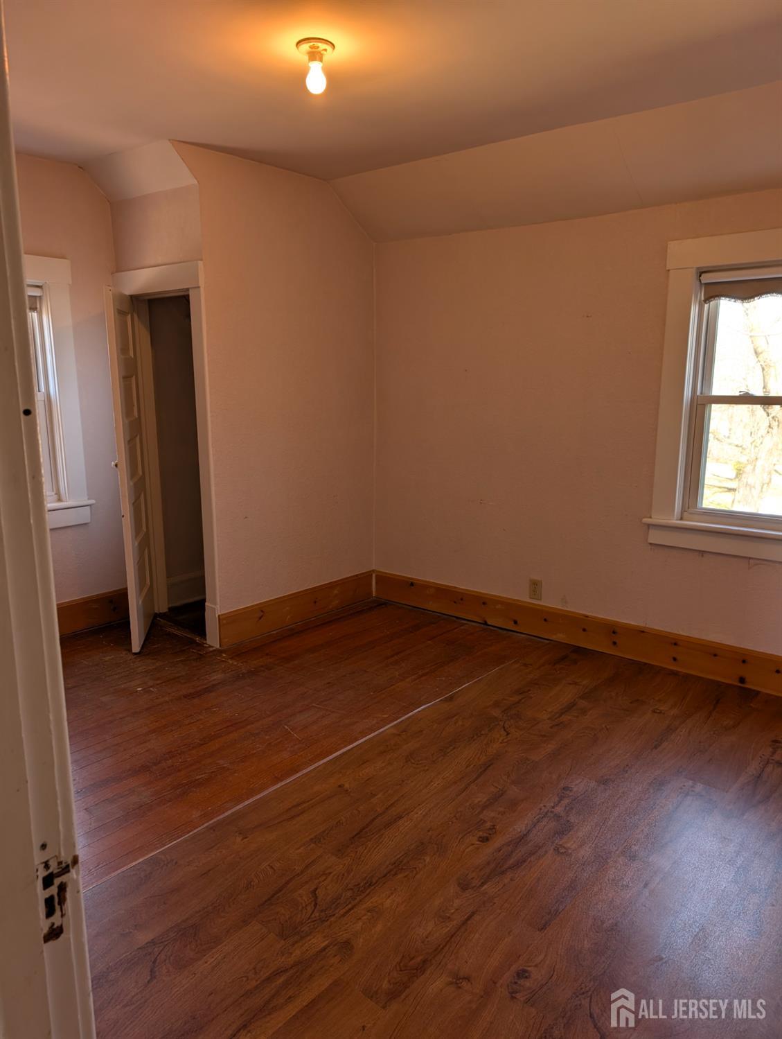 4 New Amwell Road Hillsborough, NJ 08844 - Photo 9 of 12 an empty room with wooden floor and windows
