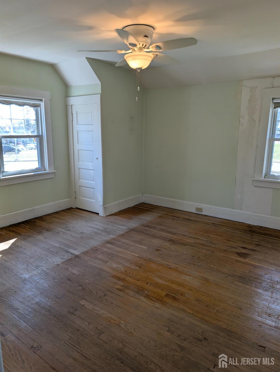 4 New Amwell Road Hillsborough, NJ 08844 - Photo 10 of 12 an empty room with wooden floor chandelier fan and windows