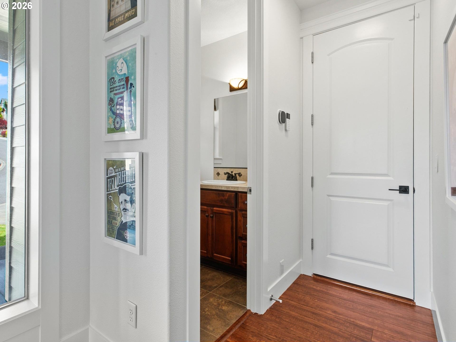 1012 Northwest Goodwin Street Camas, WA 98607 - Photo 6 of 44 a view of hallway with walk in closet and wooden floor