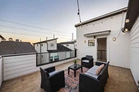 a terrace of a house with wooden floor