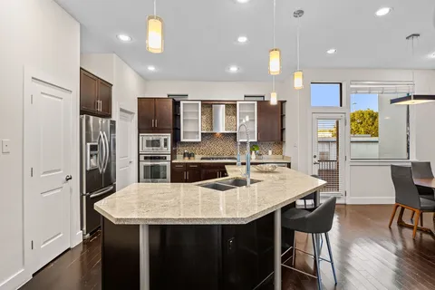 a bedroom with a bed and a chair