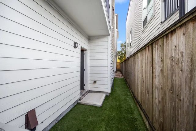 a bathroom with a granite countertop sink a mirror and a toilet