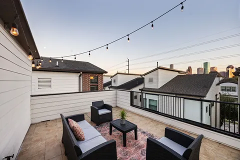 a terrace of a house with wooden floor