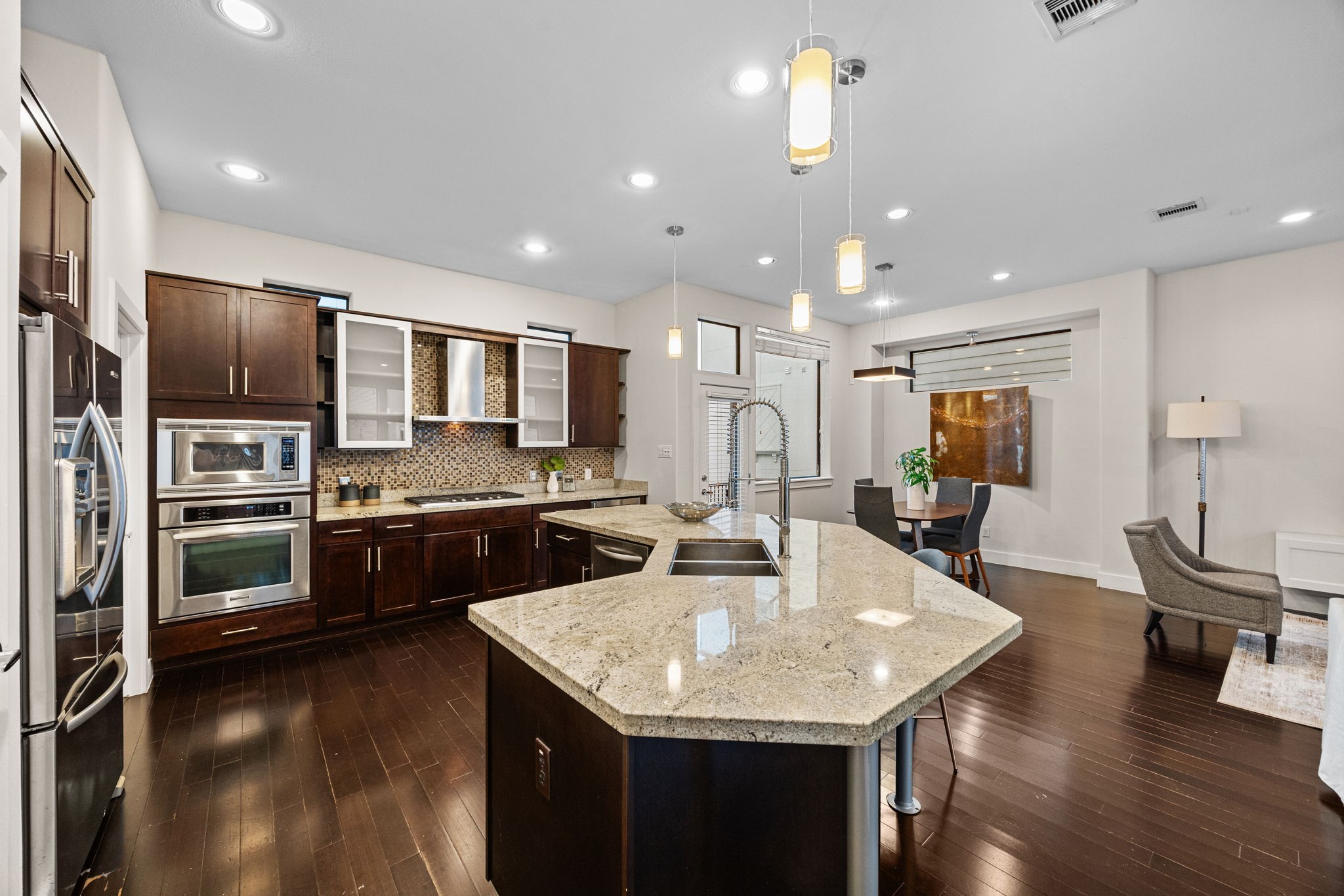 2005 Hickory Street Houston, TX 77007 - Photo 7 of 29 a kitchen with a center island appliances and wooden floor