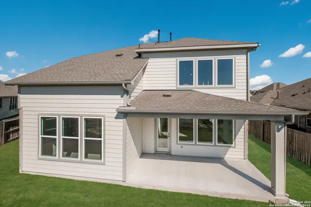 a view of house with a yard