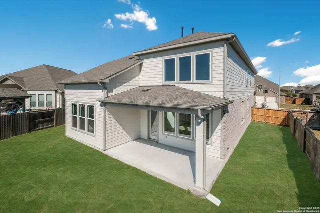 a front view of a house with yard and porch