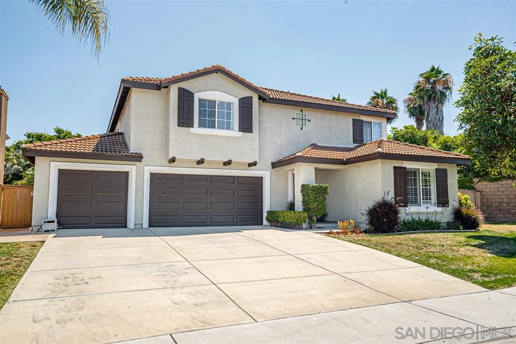 300 River Ranch Way Oceanside, CA 92057 - Photo 1 of 25 a front view of a house with a yard and potted plants