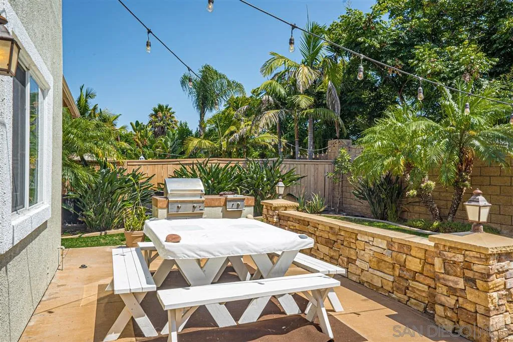 300 River Ranch Way Oceanside, CA 92057 - Photo 23 of 25 a view of a patio with table and chairs and potted plants
