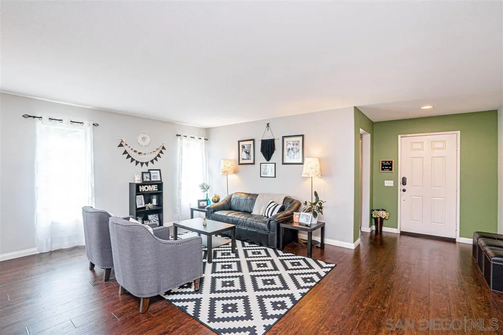 300 River Ranch Way Oceanside, CA 92057 - Photo 3 of 25 a living room with furniture and wooden floor