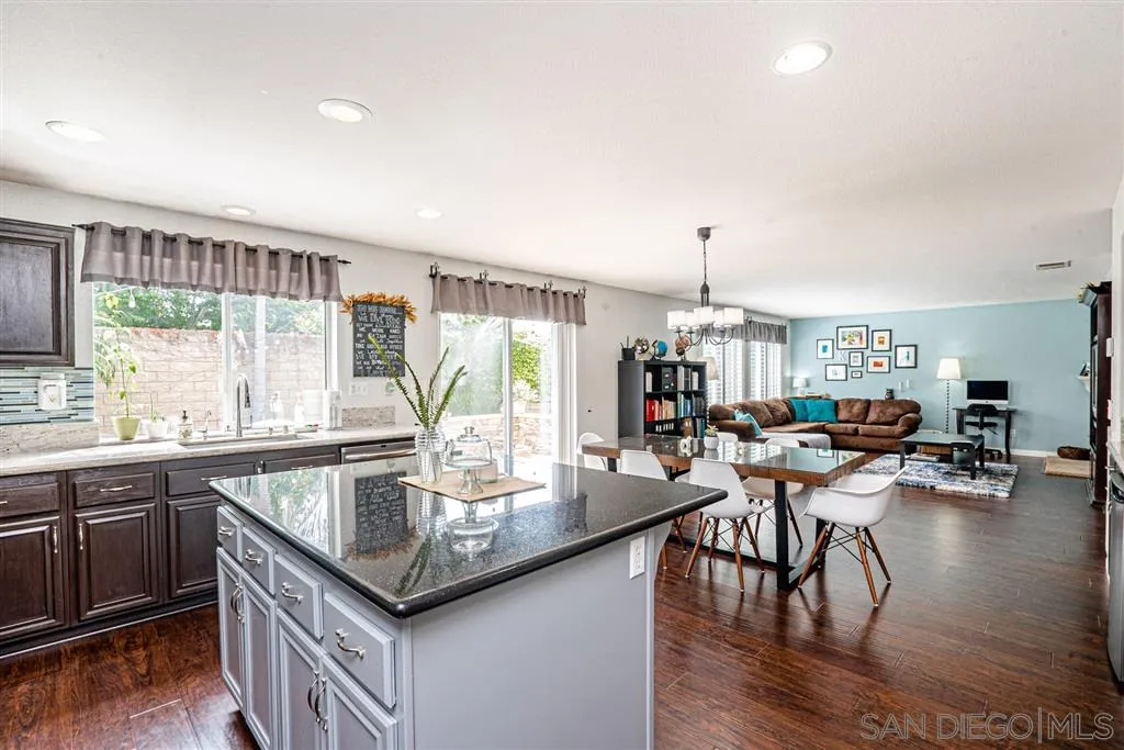300 River Ranch Way Oceanside, CA 92057 - Photo 8 of 25 a very nice looking dining room with kitchen island furniture a large window and a view of living room
