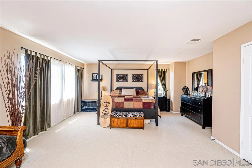 300 River Ranch Way Oceanside, CA 92057 - Photo 9 of 25 a bedroom with furniture and a large window