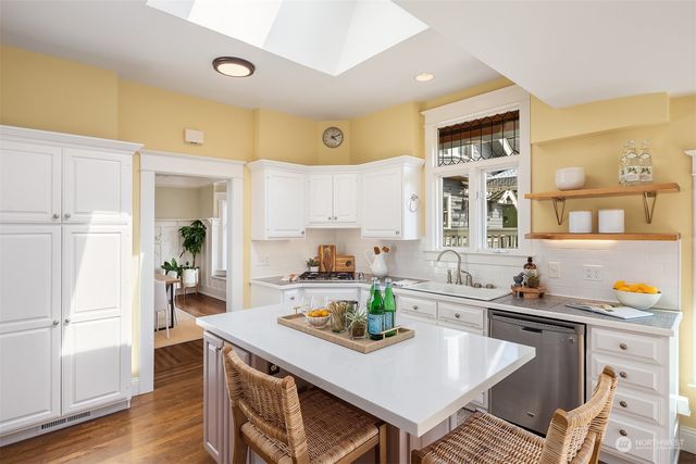a kitchen with a table and chairs in it