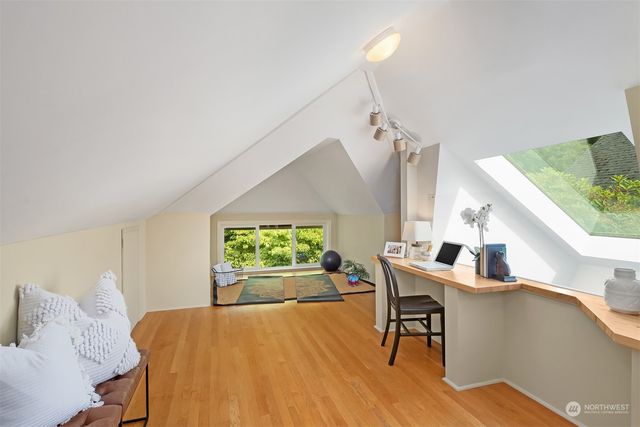 a bedroom with a bed and a table in it