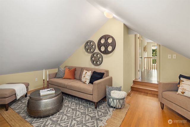a living room with furniture and a rug