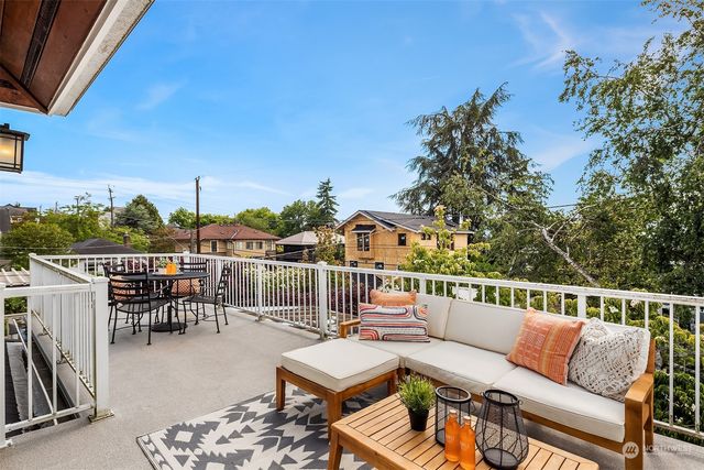 a balcony with furniture and city view