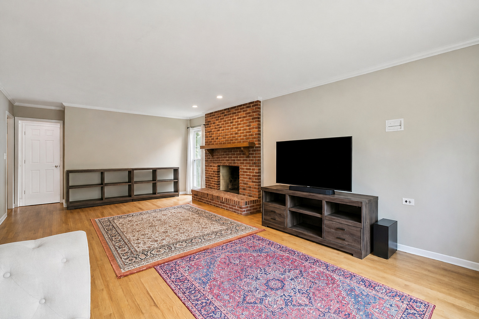 250 Wilshire Road Lake Forest, IL 60045 - Photo 9 of 28 a living room with a flat screen tv and a rug