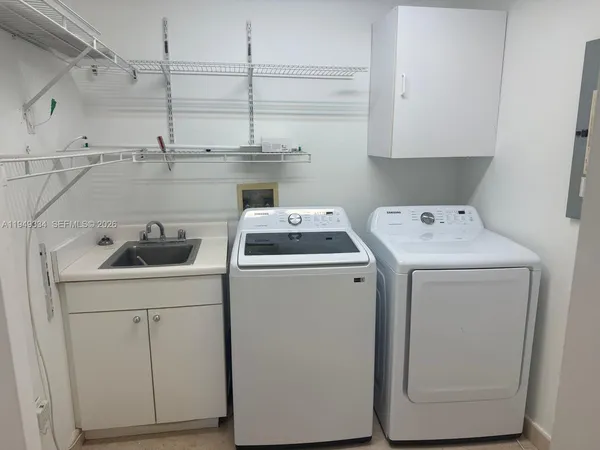 a utility room with dryer and washer