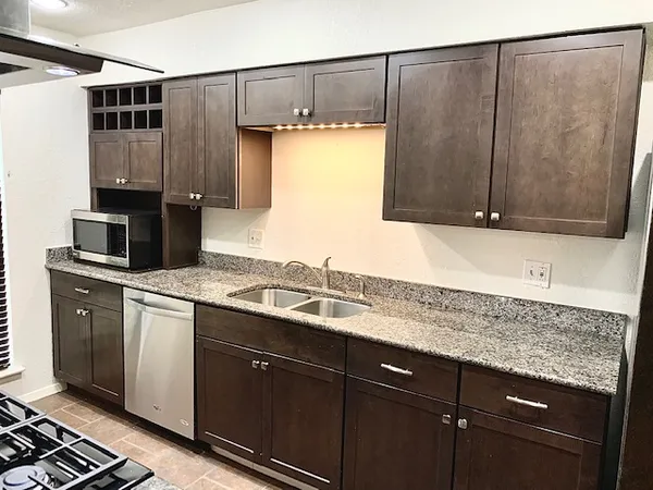 a kitchen with a sink and cabinets