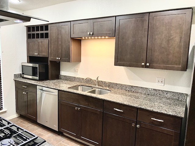6114 Hogan Avenue Austin, TX 78741 - Photo 4 of 16 a kitchen with a sink and cabinets