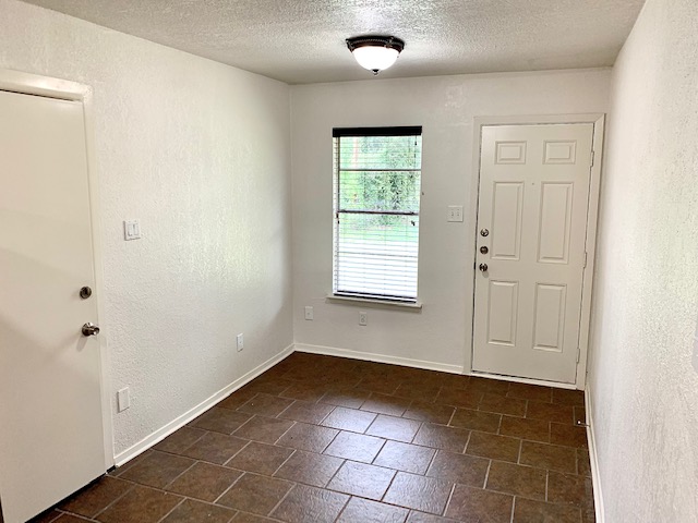 6114 Hogan Avenue Austin, TX 78741 - Photo 9 of 16 an empty room with windows