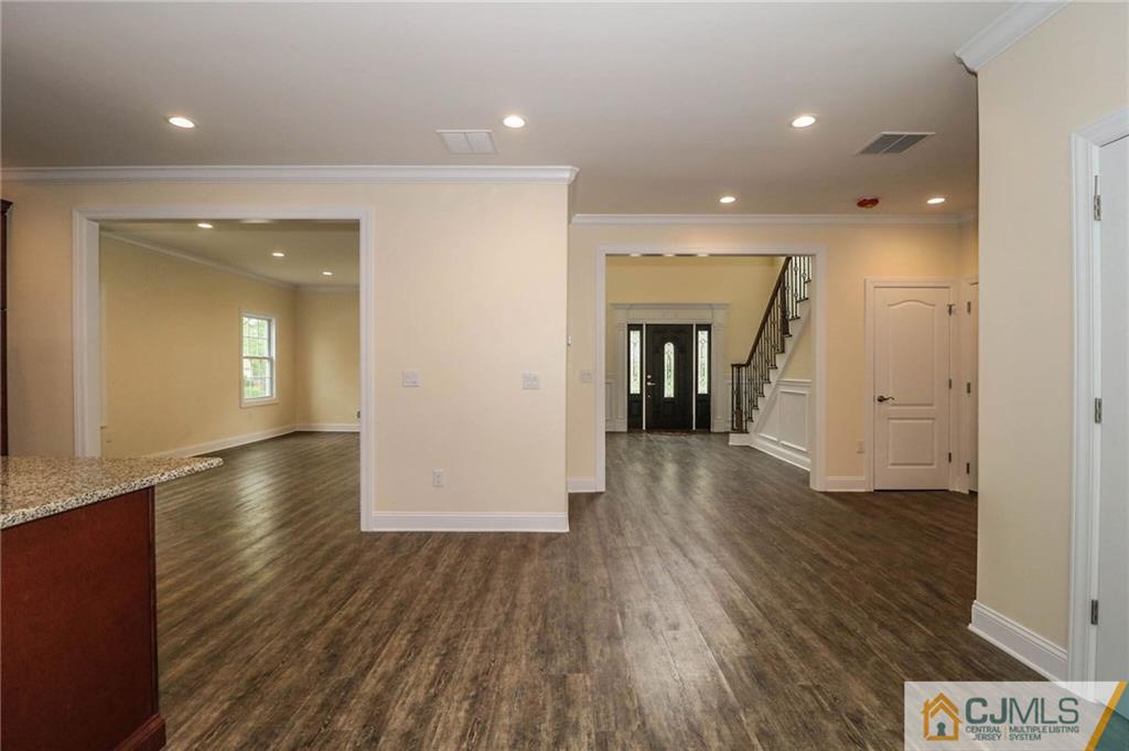 64 Winthrop Road Edison, NJ 08817 - Photo 14 of 24 wooden floor in an empty room with a window