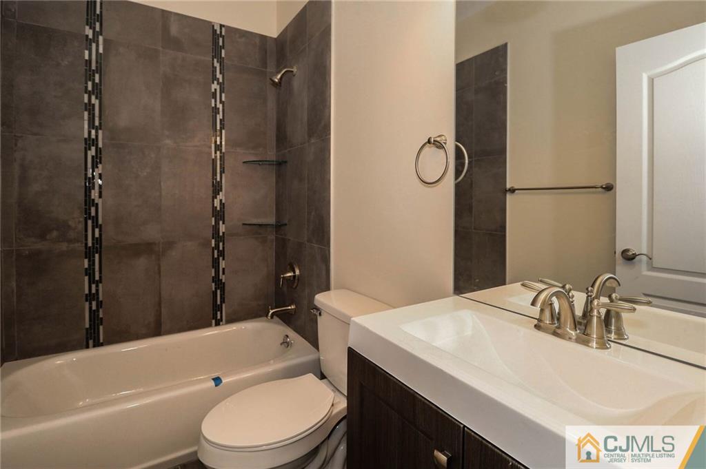 64 Winthrop Road Edison, NJ 08817 - Photo 19 of 24 a bathroom with a sink toilet and shower