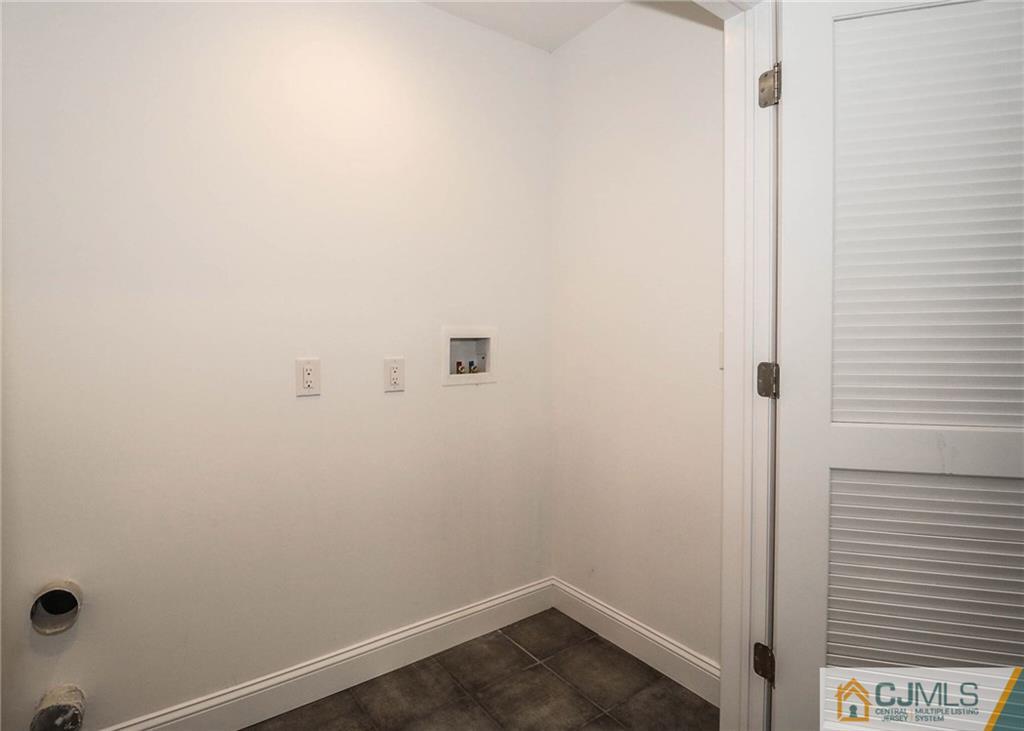 64 Winthrop Road Edison, NJ 08817 - Photo 21 of 24 a small space with wooden floor and a window