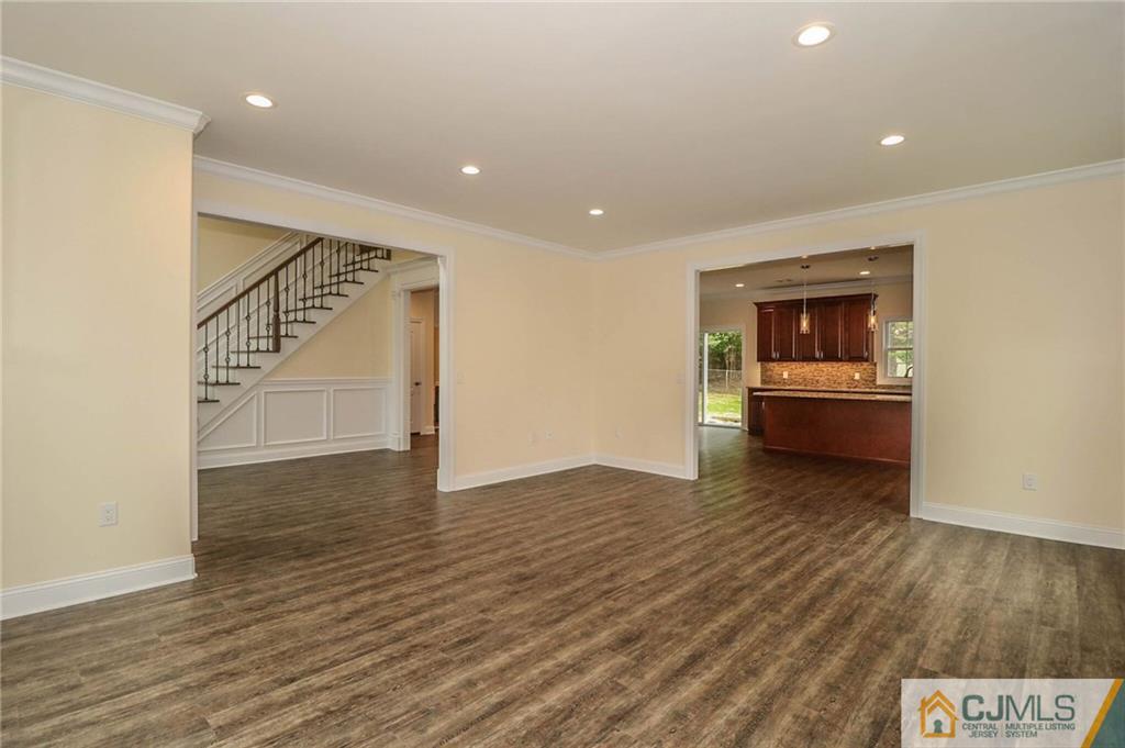 64 Winthrop Road Edison, NJ 08817 - Photo 23 of 24 a view of a livingroom with wooden floor and stairs