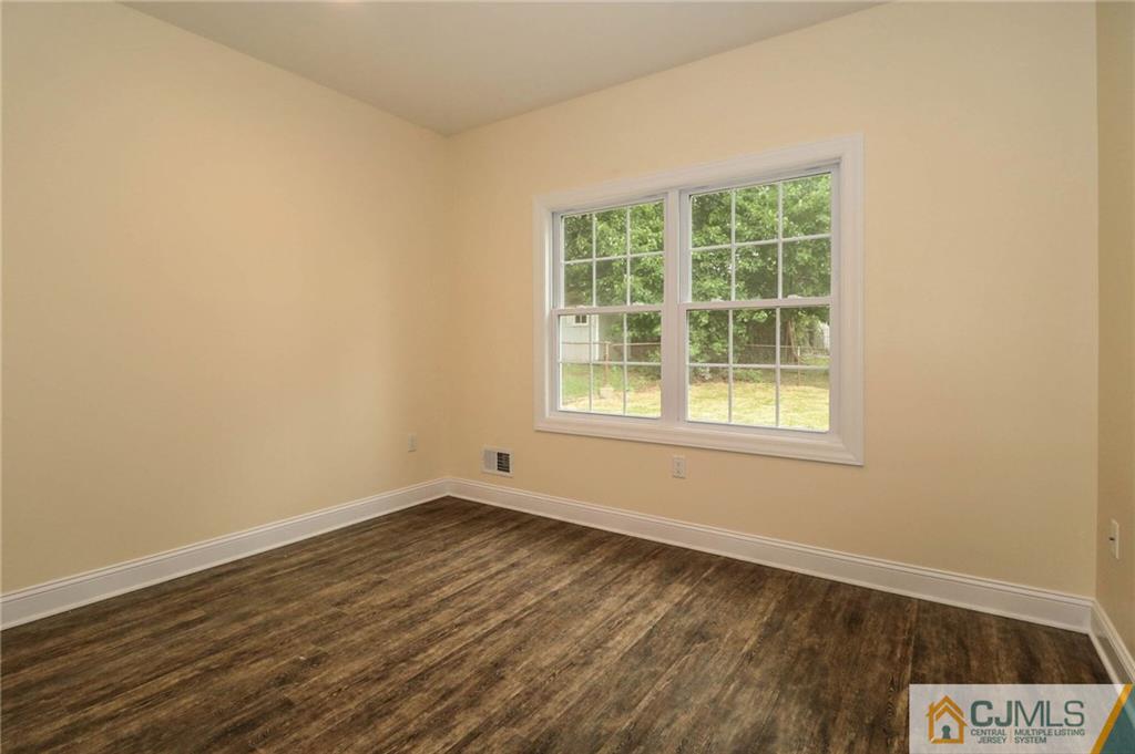 64 Winthrop Road Edison, NJ 08817 - Photo 5 of 24 an empty room with a window