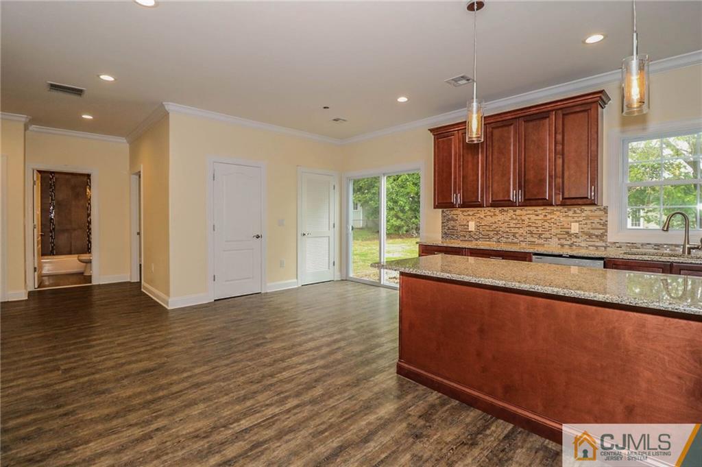 64 Winthrop Road Edison, NJ 08817 - Photo 10 of 24 a kitchen with stainless steel appliances granite countertop a stove a sink and a large window