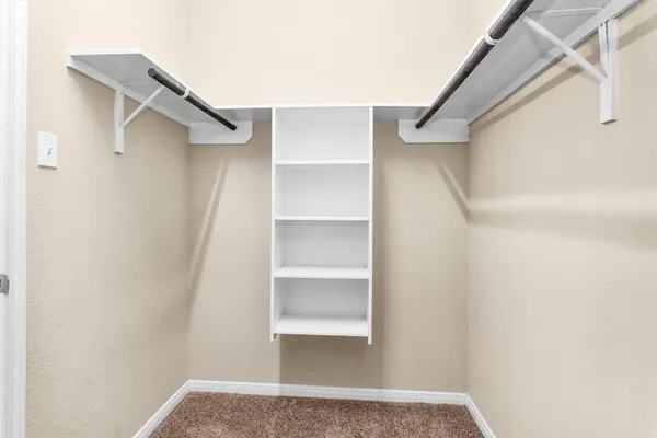 a view of an empty walk in closet