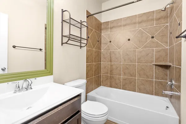 a bathroom with a sink a toilet and a bathtub
