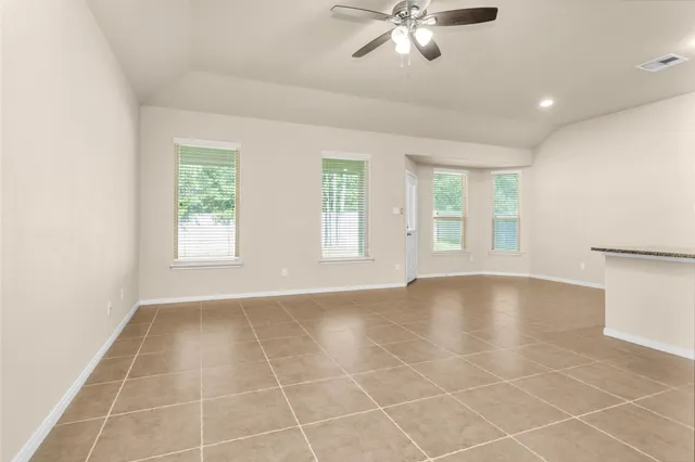 a view of an empty room with windows