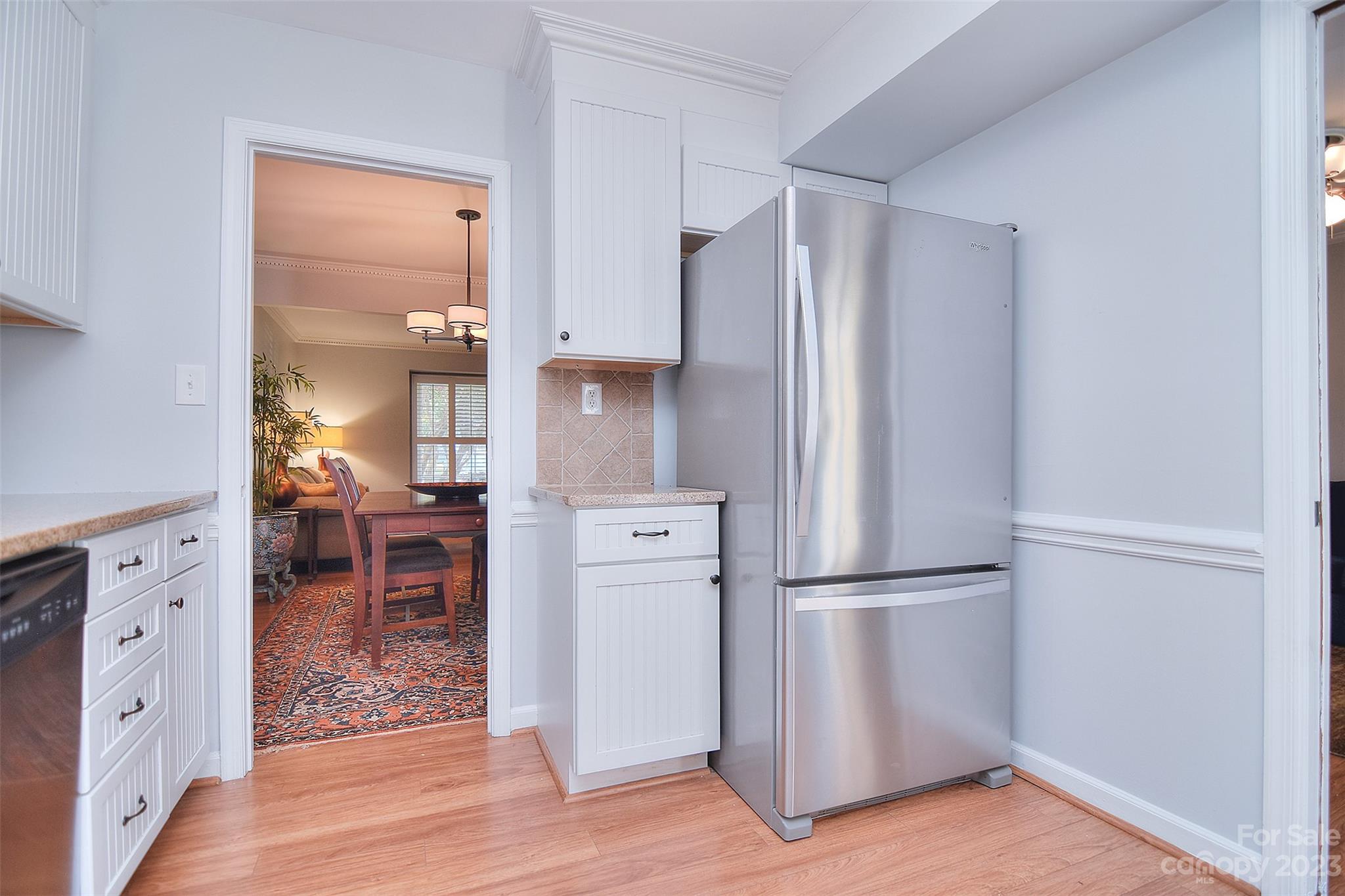 4415 Simsbury Road Charlotte, NC 28226 - Photo 13 of 36 a kitchen with white cabinets and stainless steel appliances