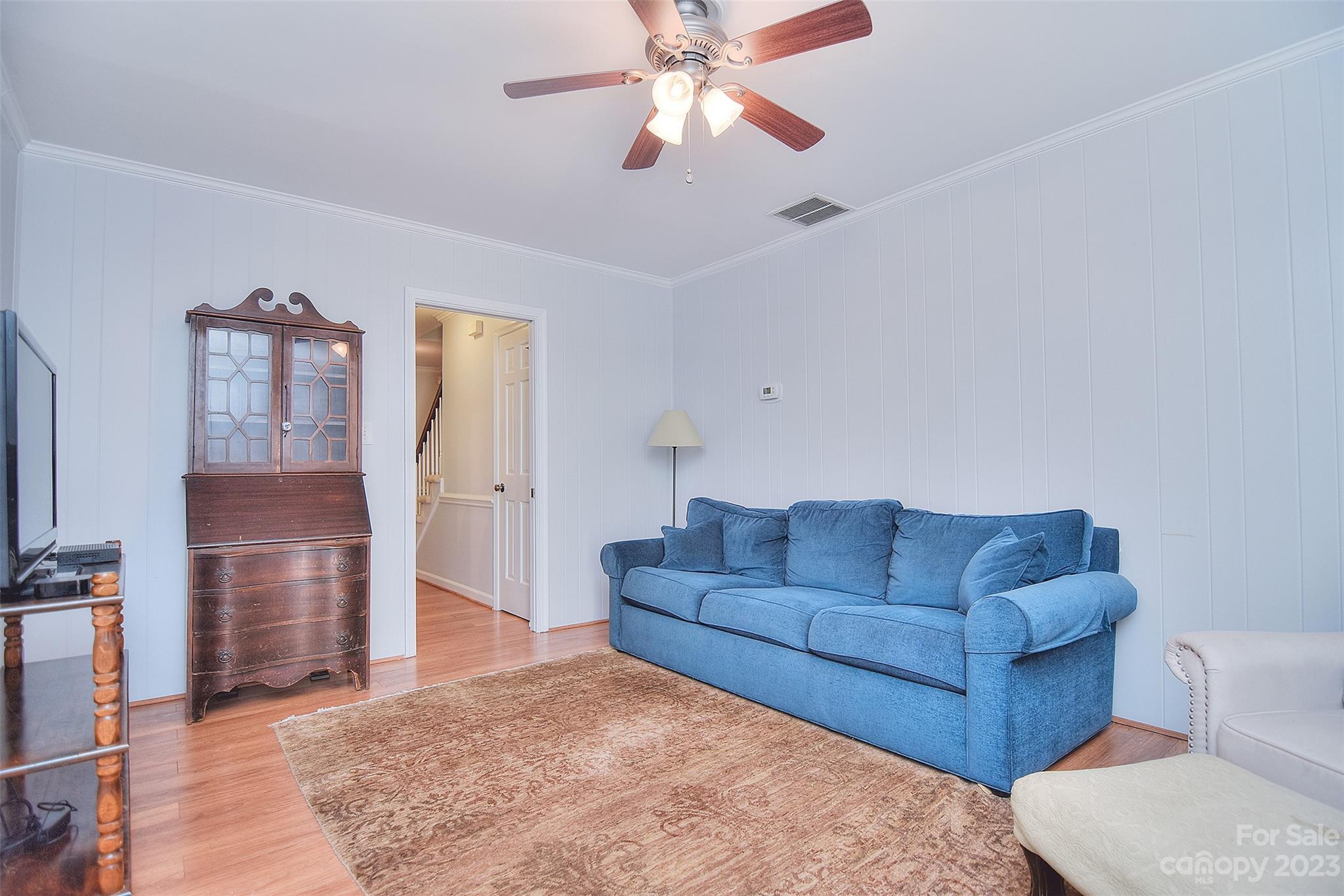 4415 Simsbury Road Charlotte, NC 28226 - Photo 16 of 36 a living room with furniture and a flat screen tv