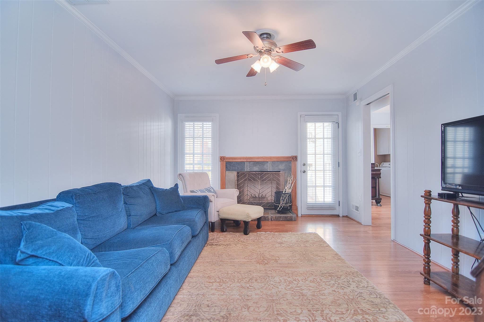 4415 Simsbury Road Charlotte, NC 28226 - Photo 17 of 36 a living room with furniture and a fireplace