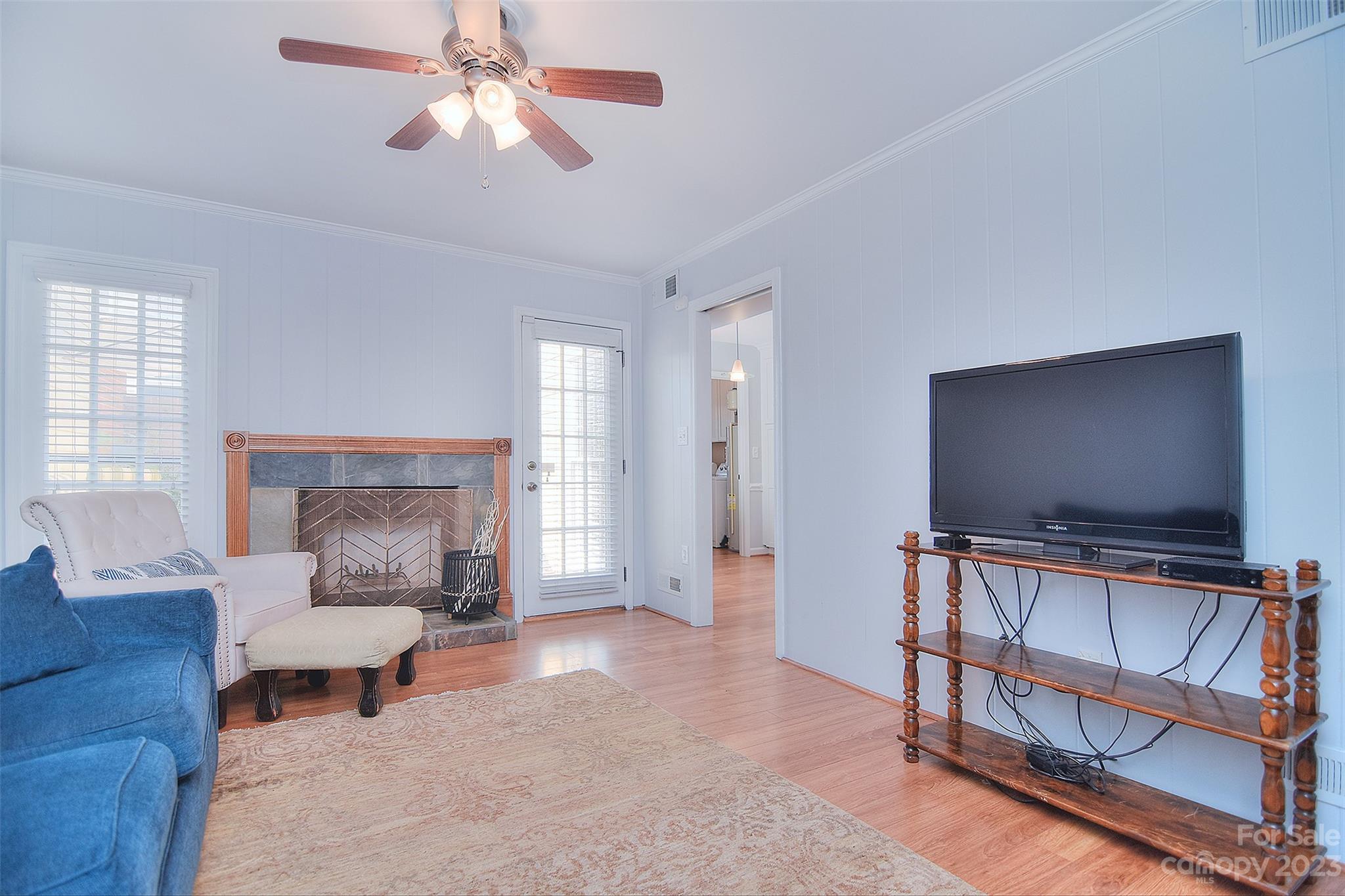 4415 Simsbury Road Charlotte, NC 28226 - Photo 19 of 36 a living room with furniture and a flat screen tv