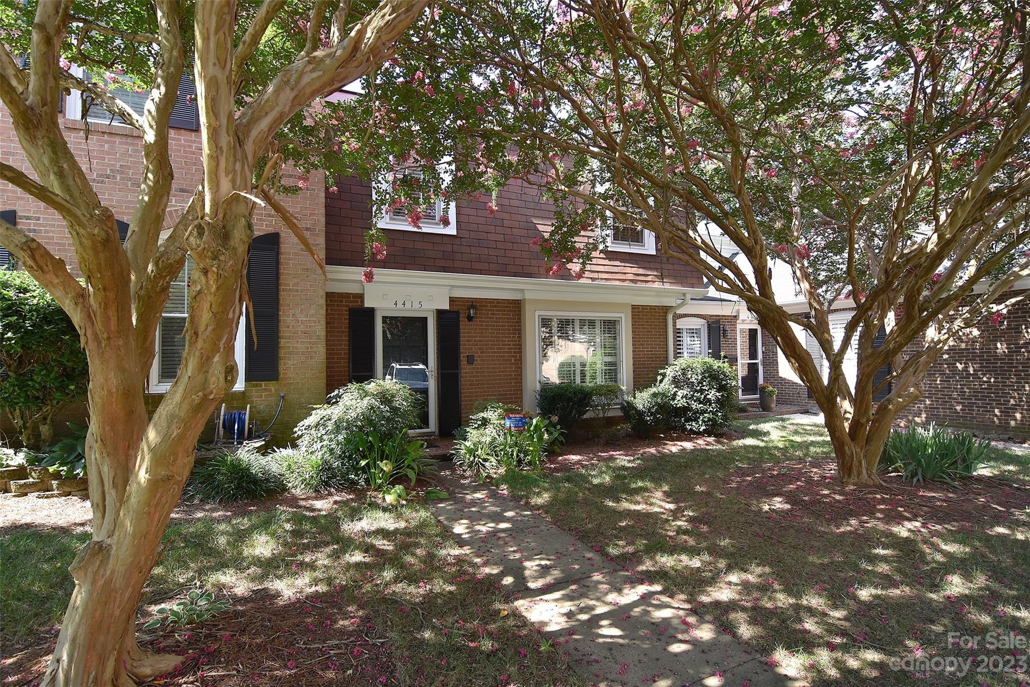 4415 Simsbury Road Charlotte, NC 28226 - Photo 2 of 36 a view of a house with a tree in the yard