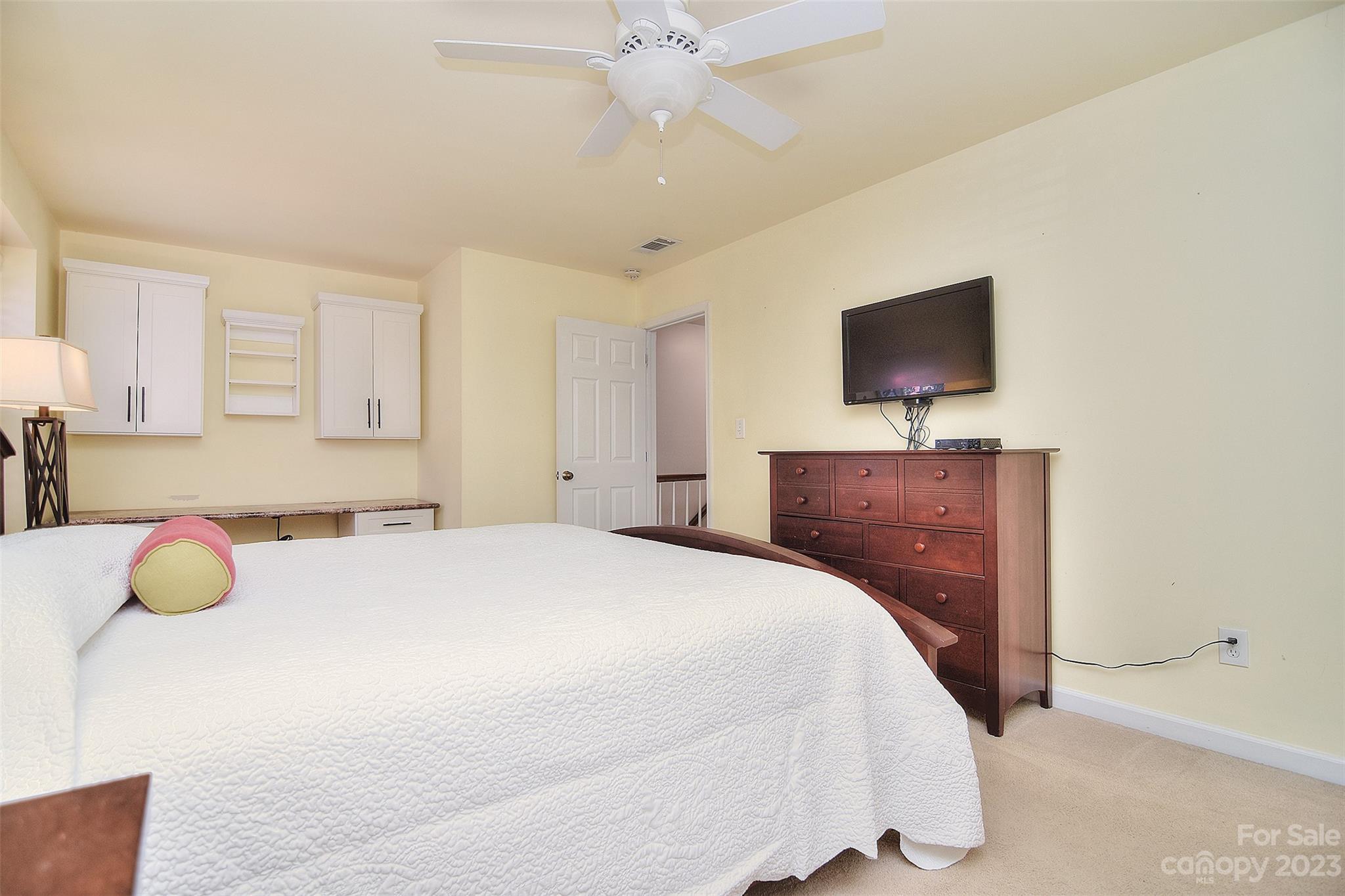 4415 Simsbury Road Charlotte, NC 28226 - Photo 25 of 36 a bedroom with a bed and a flat screen tv