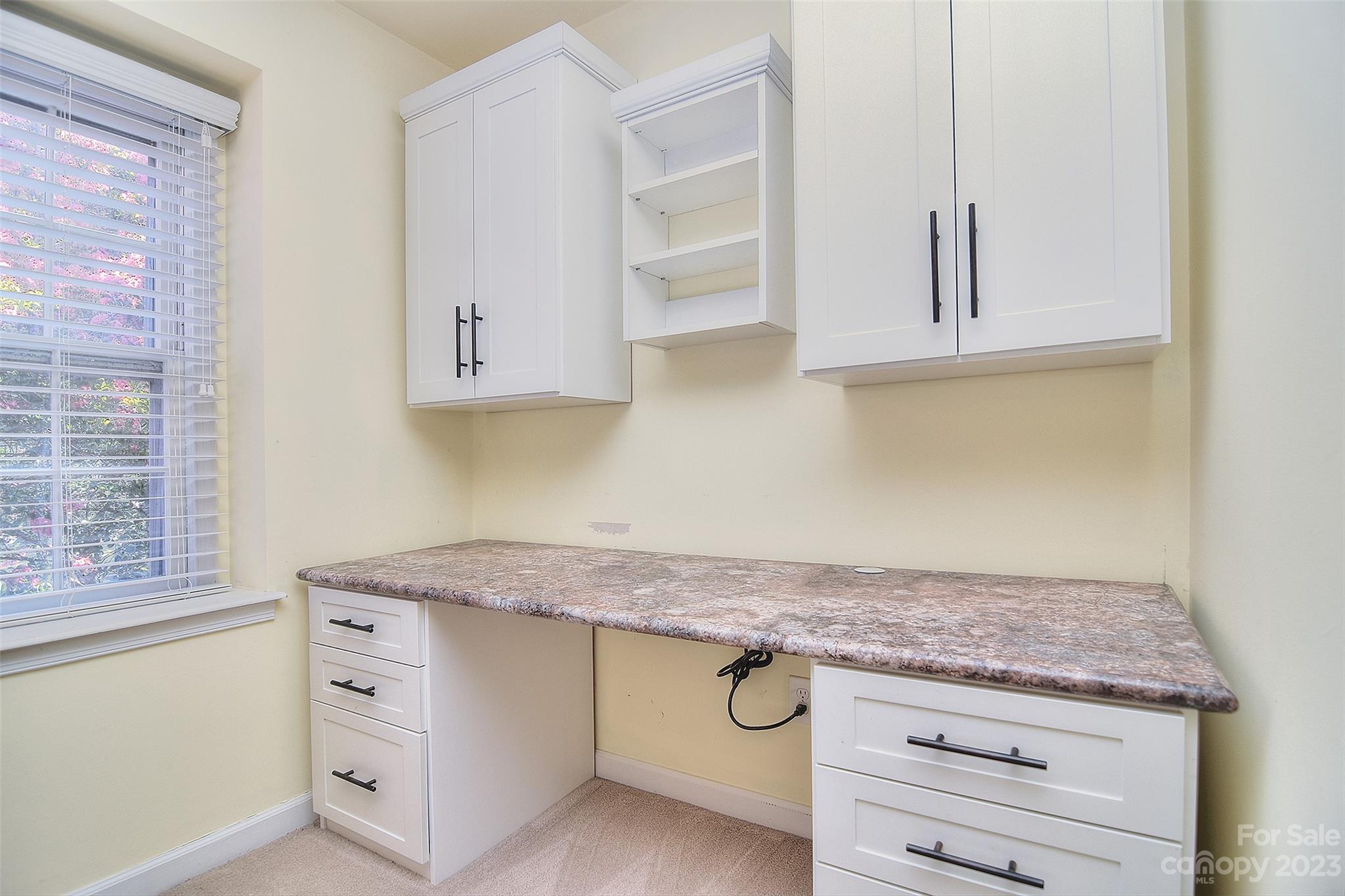 4415 Simsbury Road Charlotte, NC 28226 - Photo 26 of 36 a kitchen with granite countertop white cabinets and a stove