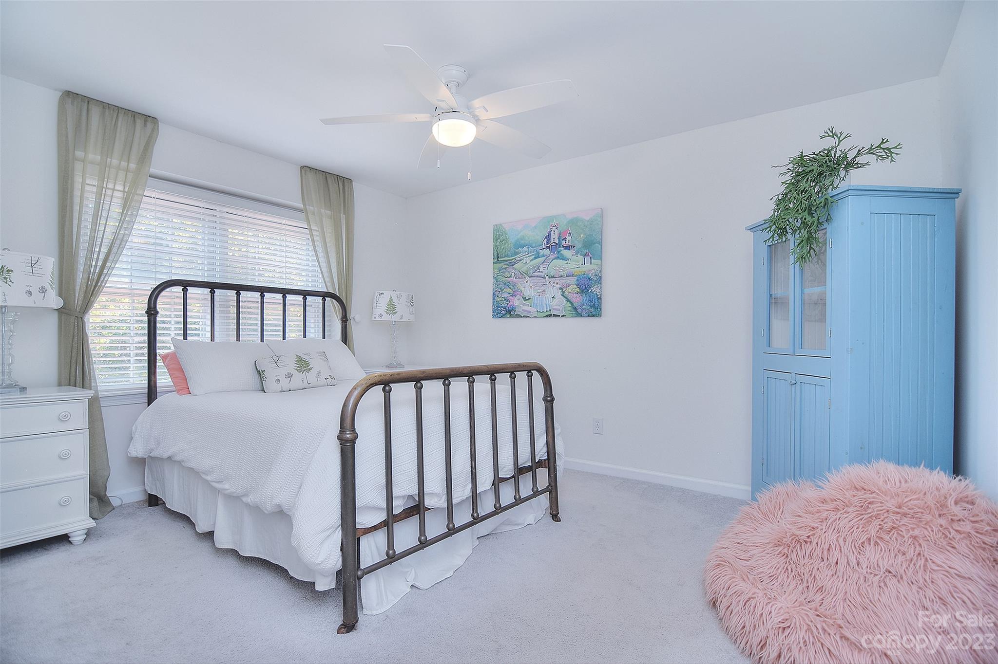 4415 Simsbury Road Charlotte, NC 28226 - Photo 28 of 36 a bed room with a bed and a window