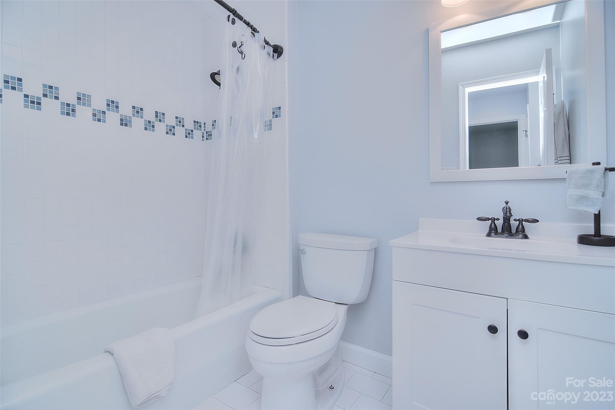 4415 Simsbury Road Charlotte, NC 28226 - Photo 29 of 36 a bathroom with a sink a toilet and shower