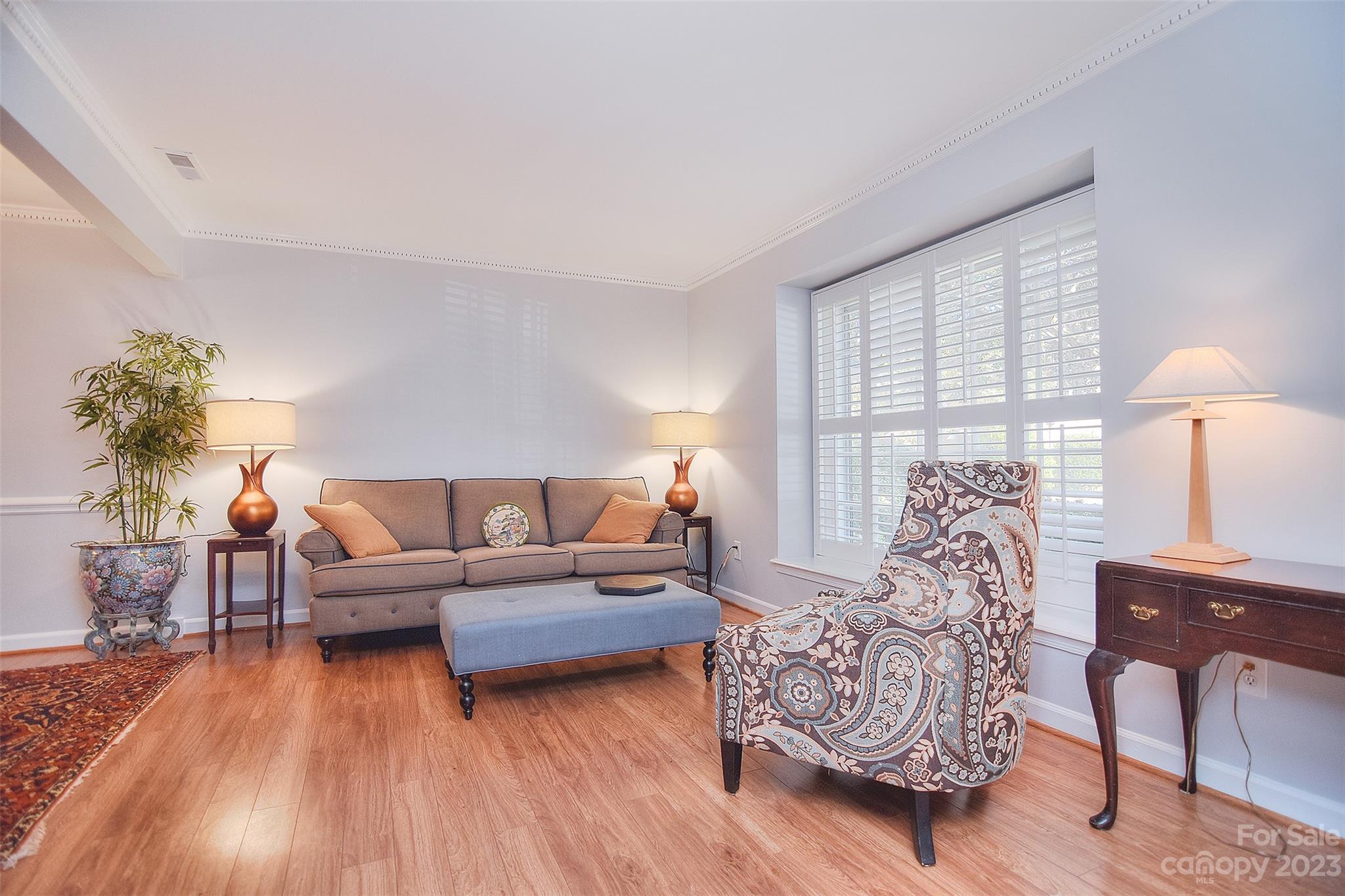 4415 Simsbury Road Charlotte, NC 28226 - Photo 3 of 36 a living room with furniture and a wooden floor